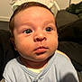 baby, infant, face, eyes, blue_clothing, indoor, portrait, skin, expression, young_child, cute, person, head, newborn, soft_light, closeup, human, child, sitting, curious