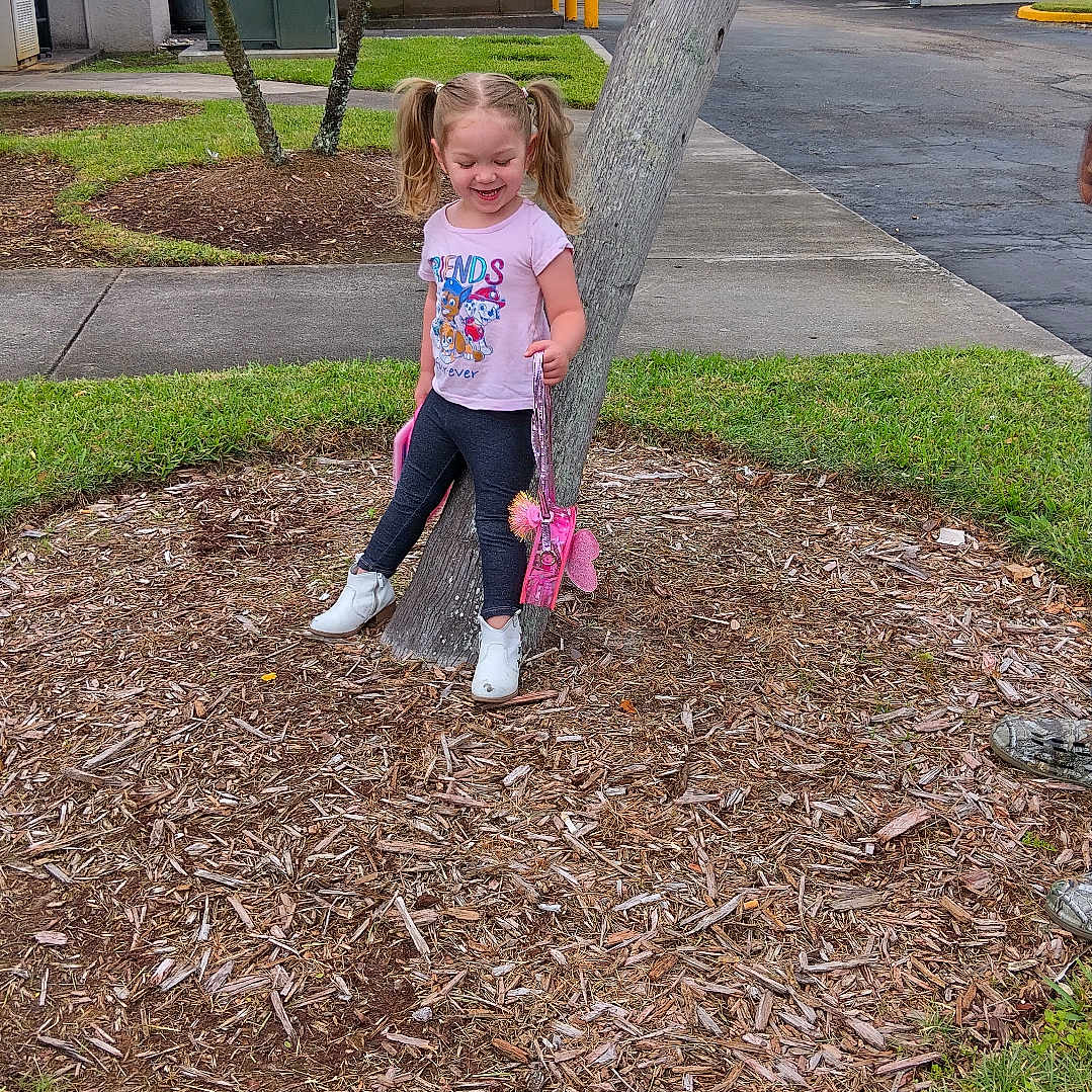 Ava joined the competition — help win amazing prizes! child, clothing, face, female, footwear, girl, grass, head, pants, path, person, photography, plant, portrait, shoe, sidewalk, soil, tree, treetrunk, walkway
