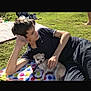 Booboo joined the competition — help win amazing prizes! boy, dog, grass, blanket, outdoor, sunny, pet, leisure, casual, friendship, polka_dot, relaxed, lying_down, small_dog, summer, daytime, park, resting, human, animal