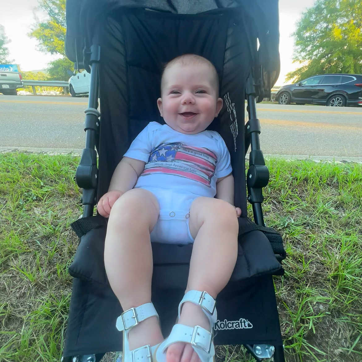 Asher joined the competition — help win amazing prizes! baby, car, city, clothing, face, footwear, grass, happy, head, machine, person, photography, plant, portrait, road, sandal, shoe, transportation, vehicle, wheel
