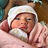 newborn, baby, infant, swaddled, pink_blanket, teddy_bear_print, hat, face, eyes, person, skin, closeup, portrait, indoor, human, child, newborn_clothing, blanket, cute, baby_wrap