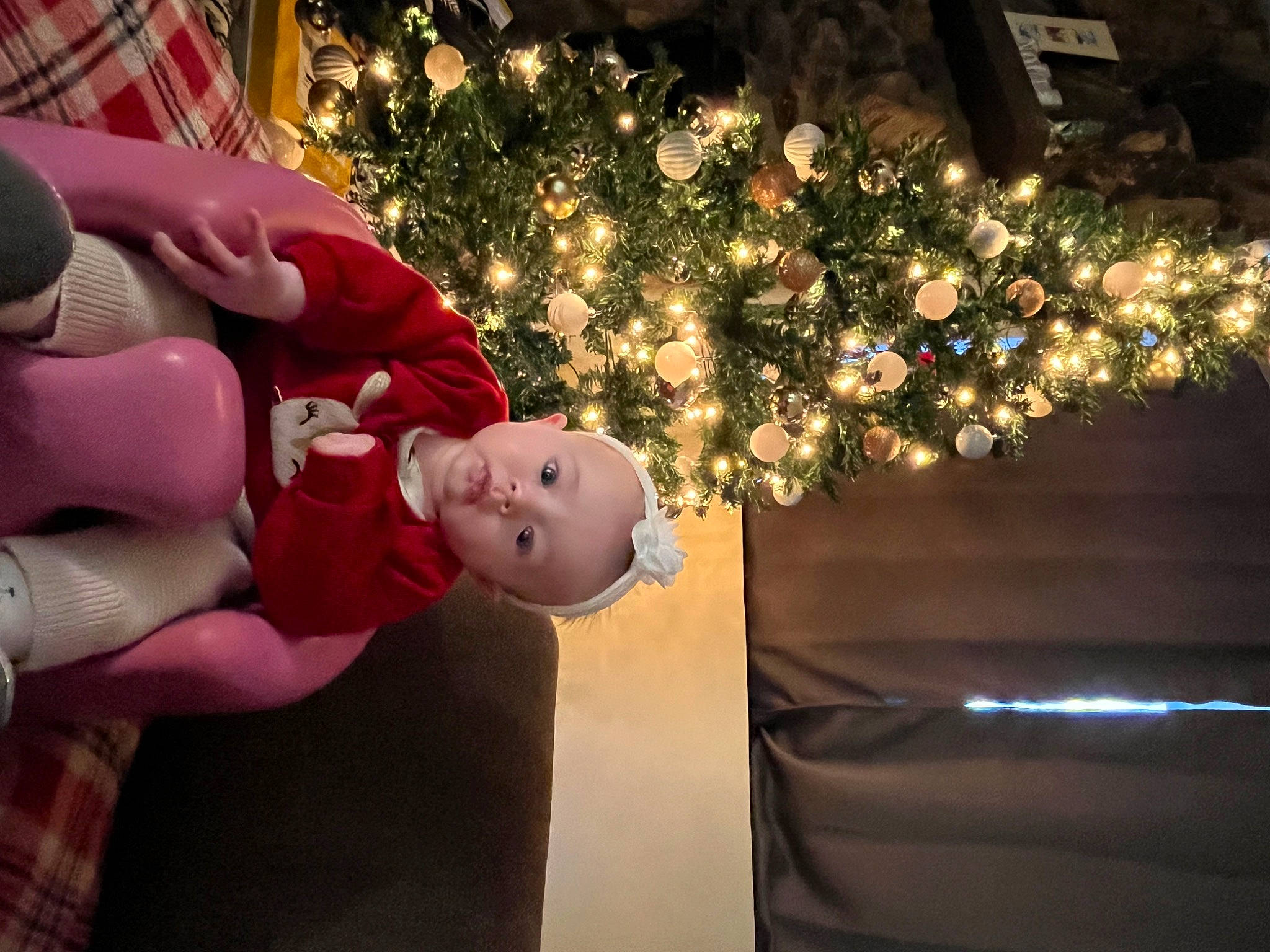 Lillie joined the competition — help win amazing prizes! carmine, christmas, christmas_decoration, christmas_eve, christmas_ornament, christmas_tree, conifer, event, fictional_character, happy, hat, holiday, holiday_ornament, interior_design, lap, ornament, person, plant, toddler, tradition