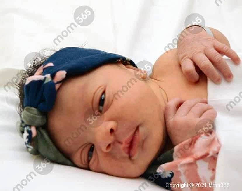 Kennedy is registered to the contest to win money with this photo: arm, baby, child, comfort, eyelash, fashion_accessory, finger, gesture, hand, happy, headpiece, headwear, human_body, jewellery, lip, mouth, nail, neck, person, skin
