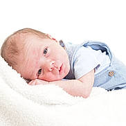 Euan is registered to the contest to win money with this photo: baby, infant, newborn, blanket, soft, blue_clothing, face, head, skin, lying_down, resting, cute, small, child, portrait, indoors, cozy, peaceful, sleepy, person