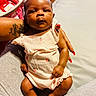 Abbiegale joined the competition — help win amazing prizes! baby, infant, child, person, arm, hand, clothing, pink_outfit, indoor, bed, tattoo, nail_polish, skin, fingers, legs, feet, comfort, resting, cute, portrait