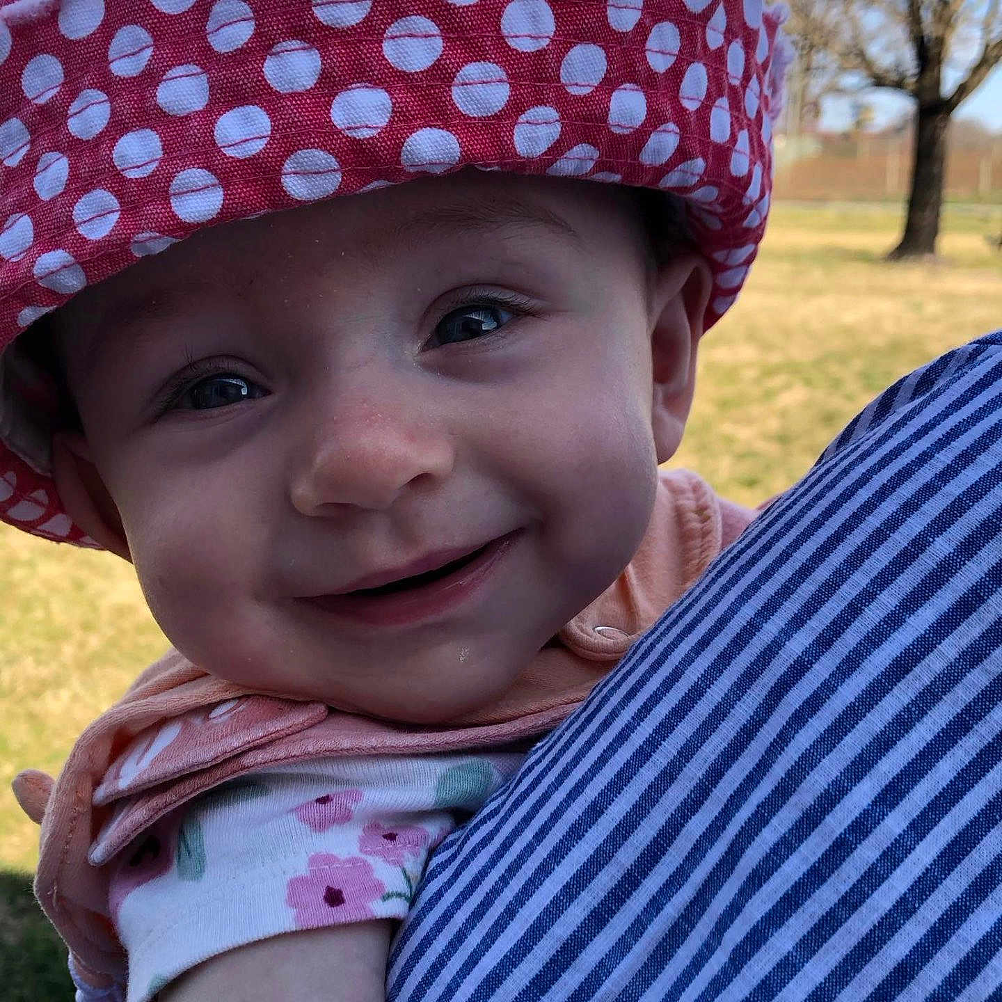 Ella-May joined the competition — help win amazing prizes! baby, bonnet, cap, clothing, dress, face, grass, happy, hat, head, nature, outdoors, park, person, photography, plant, portrait, smile, sunhat, tree