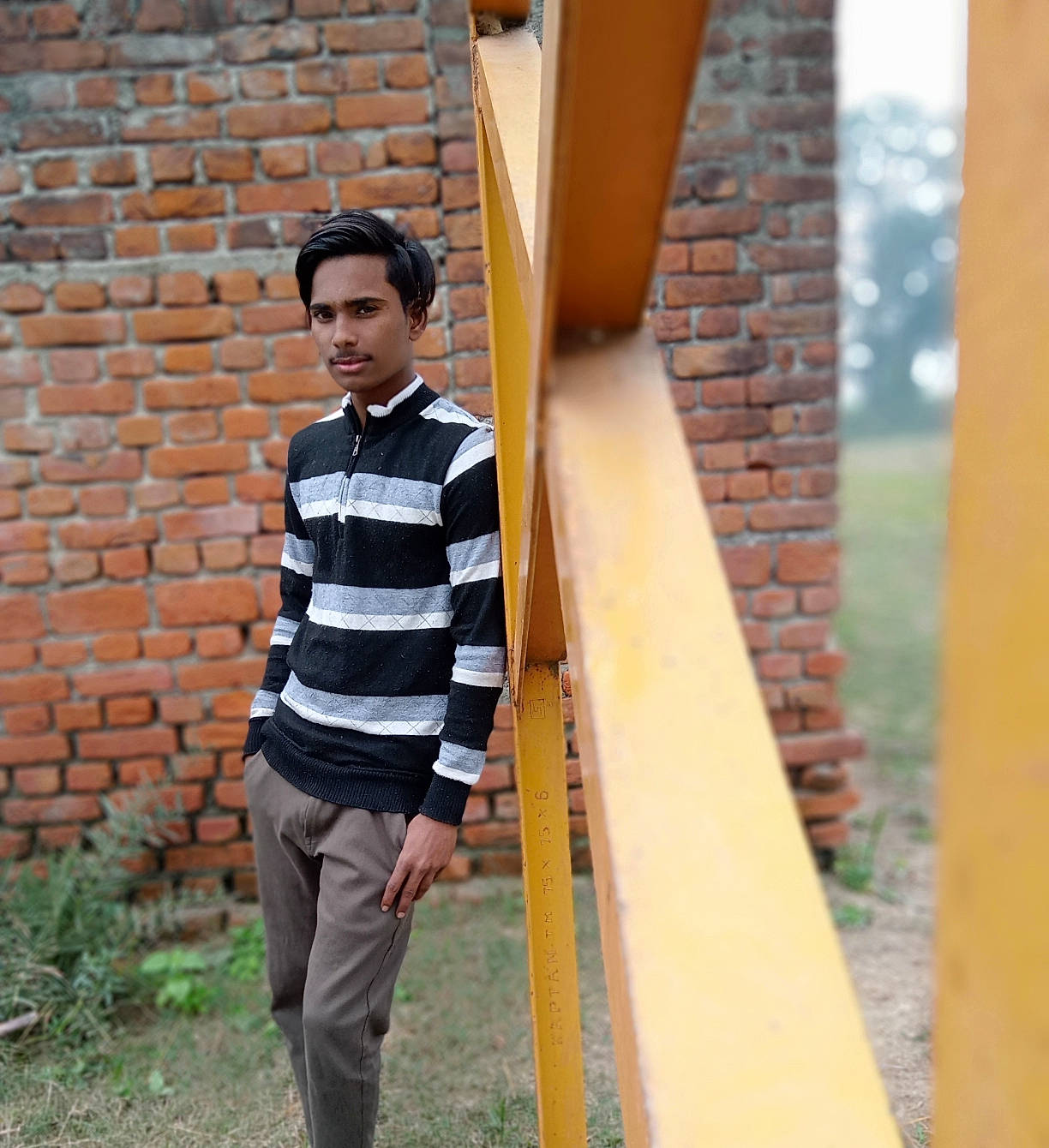 Md Zainul joined the competition — help win amazing prizes! brick, brickwork, building, child, concrete, denim, facade, grass, house, leisure, pattern, person, siding, sitting, sleeve, street_fashion, t_shirt, tints_and_shades, vacation, waist