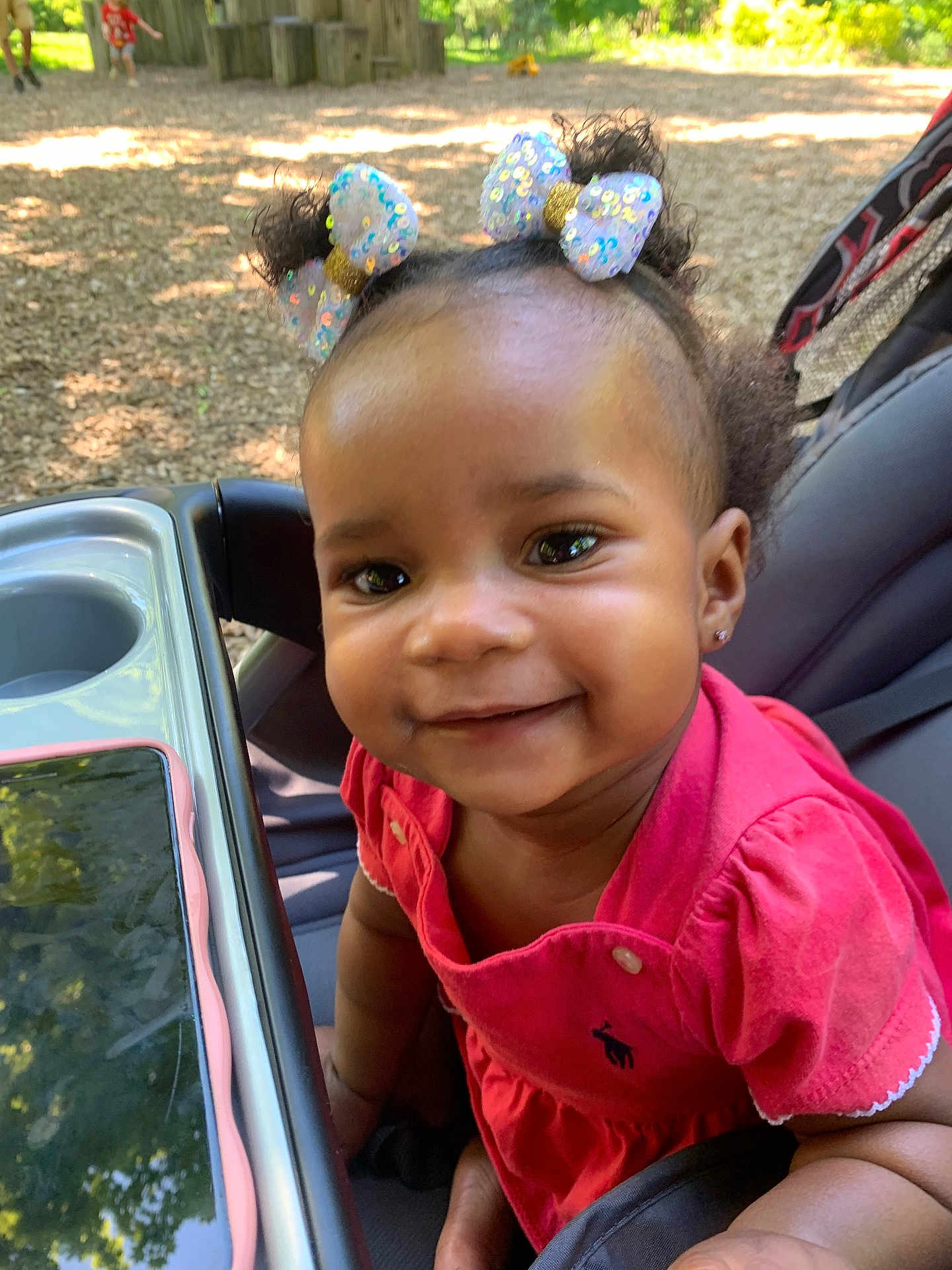 Mikayla joined the competition — help win amazing prizes! accessories, baby, child, clothing, face, female, footwear, girl, grass, happy, head, nature, outdoors, park, person, photography, plant, portrait, shoe, smile
