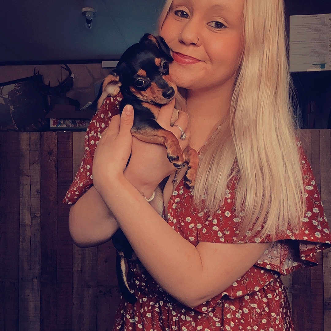 Willow Mae is registered to the contest to win money with this photo: adult, animal, bodypart, canine, clothing, dog, dress, face, female, finger, formalwear, happy, head, person, pet, photography, portrait, puppy, smile, woman