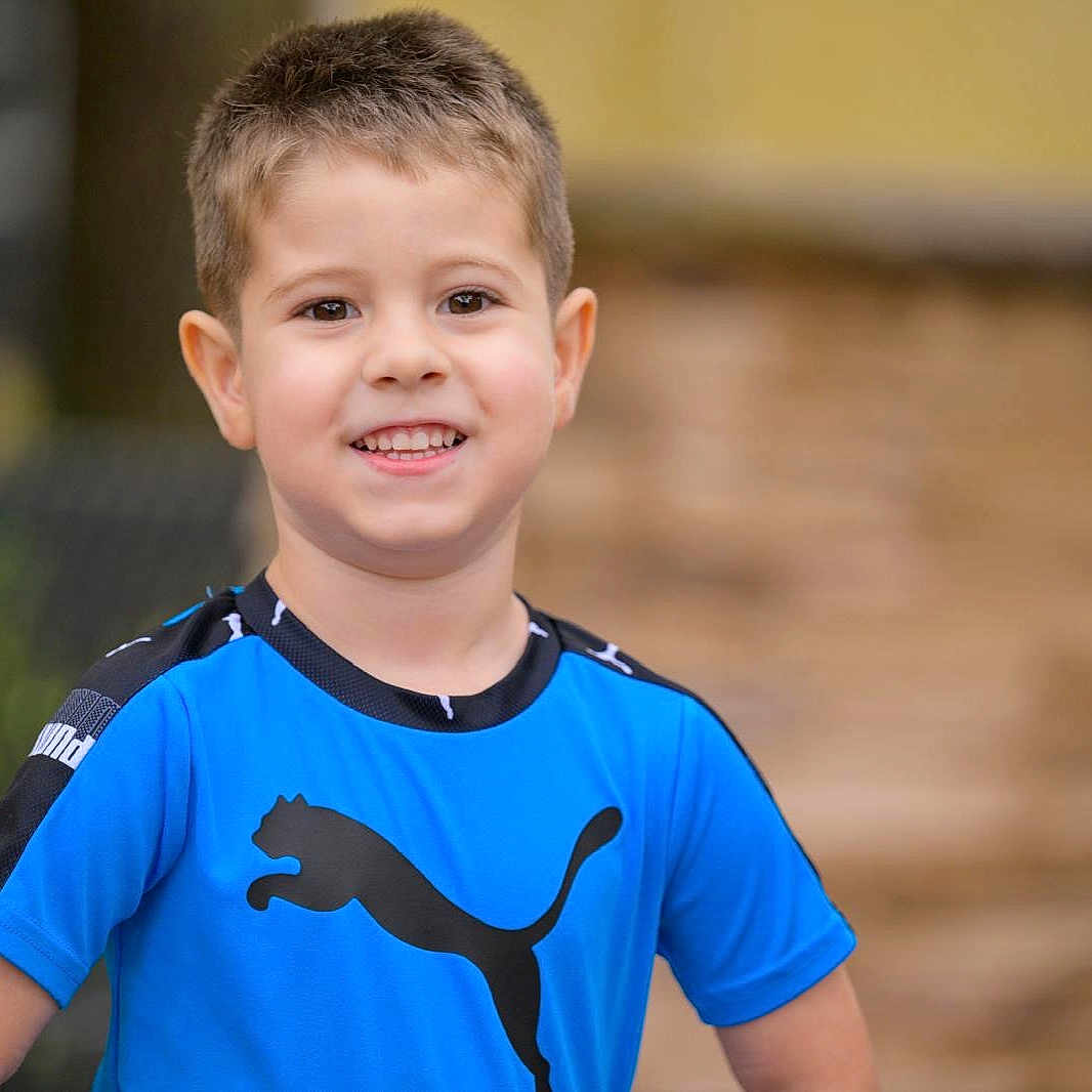 Carlos López joined the competition — help win amazing prizes! blue_shirt, blurred_background, bokeh, boy, casual_clothing, child, ears, eyes, happy, outdoor, person, portrait, puma_logo, short_hair, skin, smile, sportswear, standing, teeth, youth