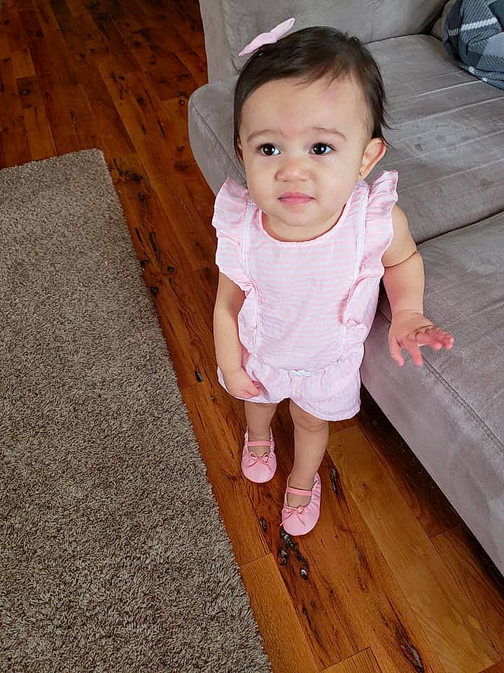 Ariah joined the competition — help win amazing prizes! baby, cheek, child, floor, flooring, leg, person, pink, skin, smile, standing, toddler, wood