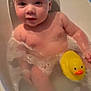 baby, bathtub, bubbles, child, foam, fun, head, indoor, infant, person, play, rubber_duck, skin, smile, soap, toddler, water, wet, yellow, young