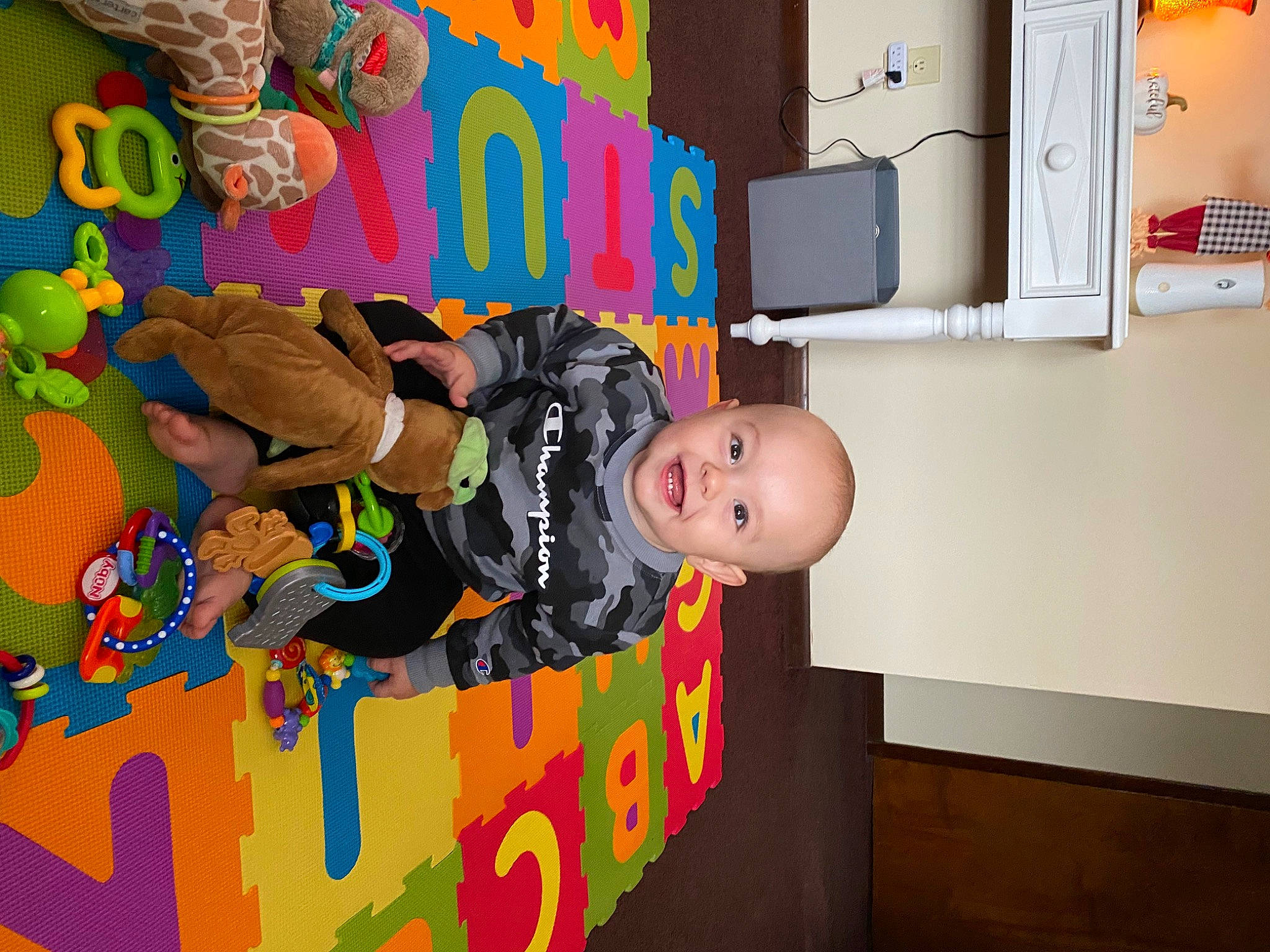 Ryder is registered to the contest to win money with this photo: animation, art, baby, baby_products, baby_toddler_clothing, baby_toys, bookcase, child, flooring, fun, happy, illustration, joy, leisure, party, person, play, room, shelf, shelving