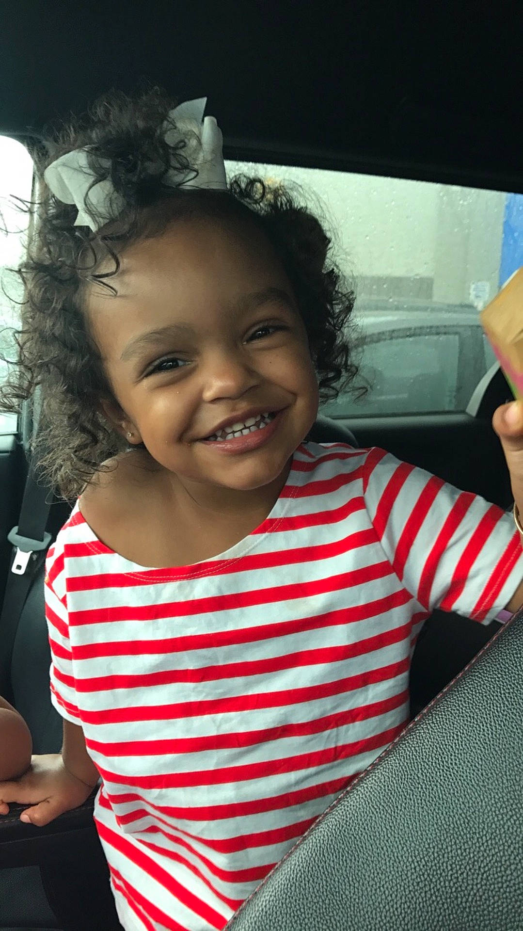 Janelle is registered to the contest to win money with this photo: beauty, black_hair, child, cool, day, emotion, eye, facial_expression, fun, girl, hairstyle, happiness, joy, laughter, person, product, skin, smile, toddler