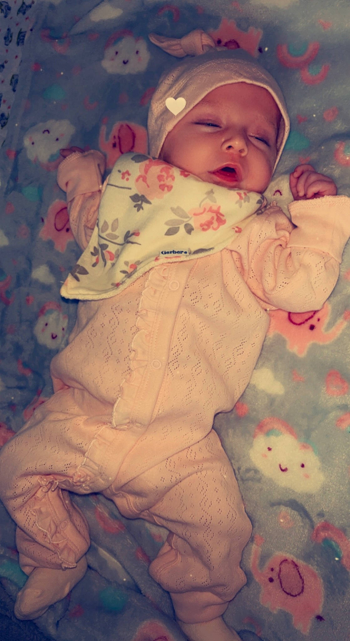 Ariah is registered to the contest to win money with this photo: arm, baby, baby_sleeping, baby_toddler_clothing, cheek, child, comfort, cool, eye, hand, headgear, headwear, human_body, linens, lip, nose, person, pink, skin, sleeve