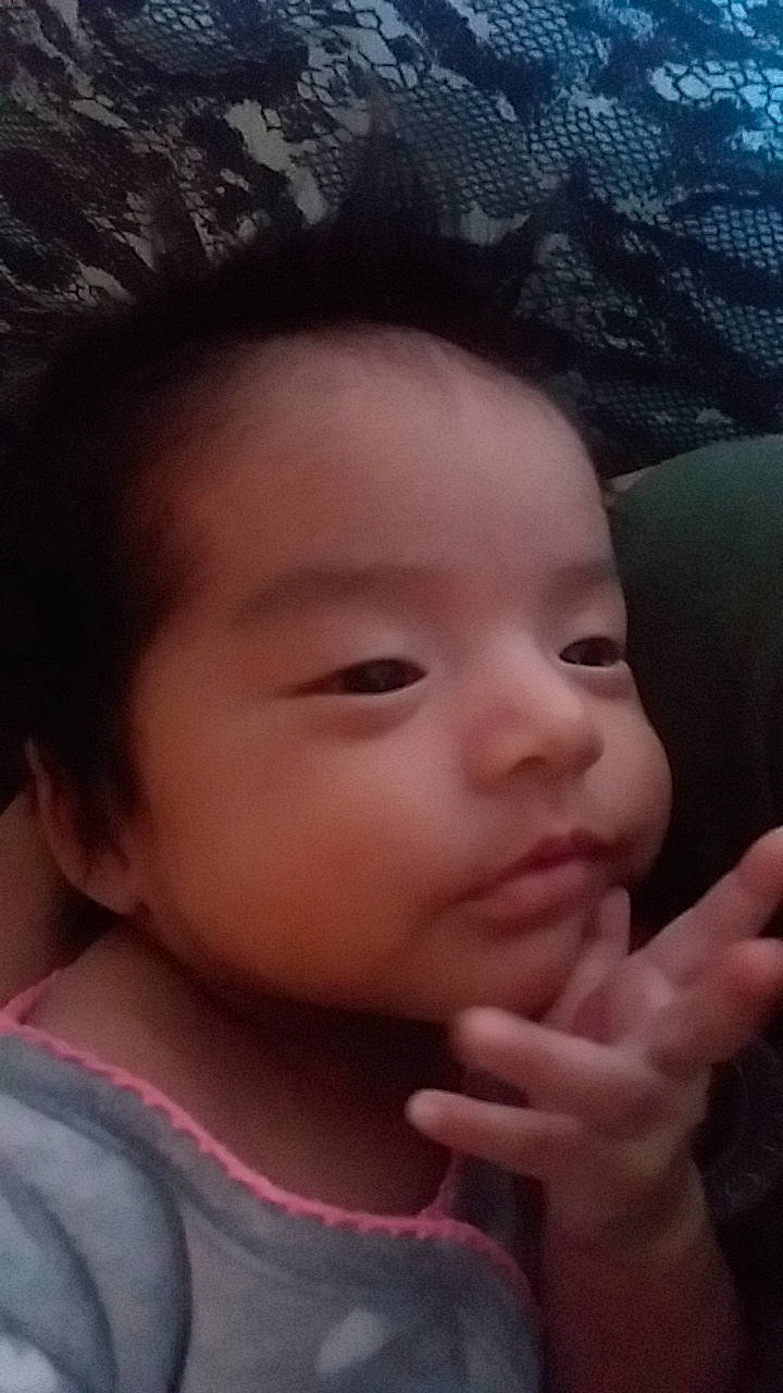 Johniah is registered to the contest to win money with this photo: baby, beauty, black_hair, cheek, child, chin, ear, eye, eyebrow, face, finger, forehead, hair, hand, head, lip, mouth, nose, person, skin