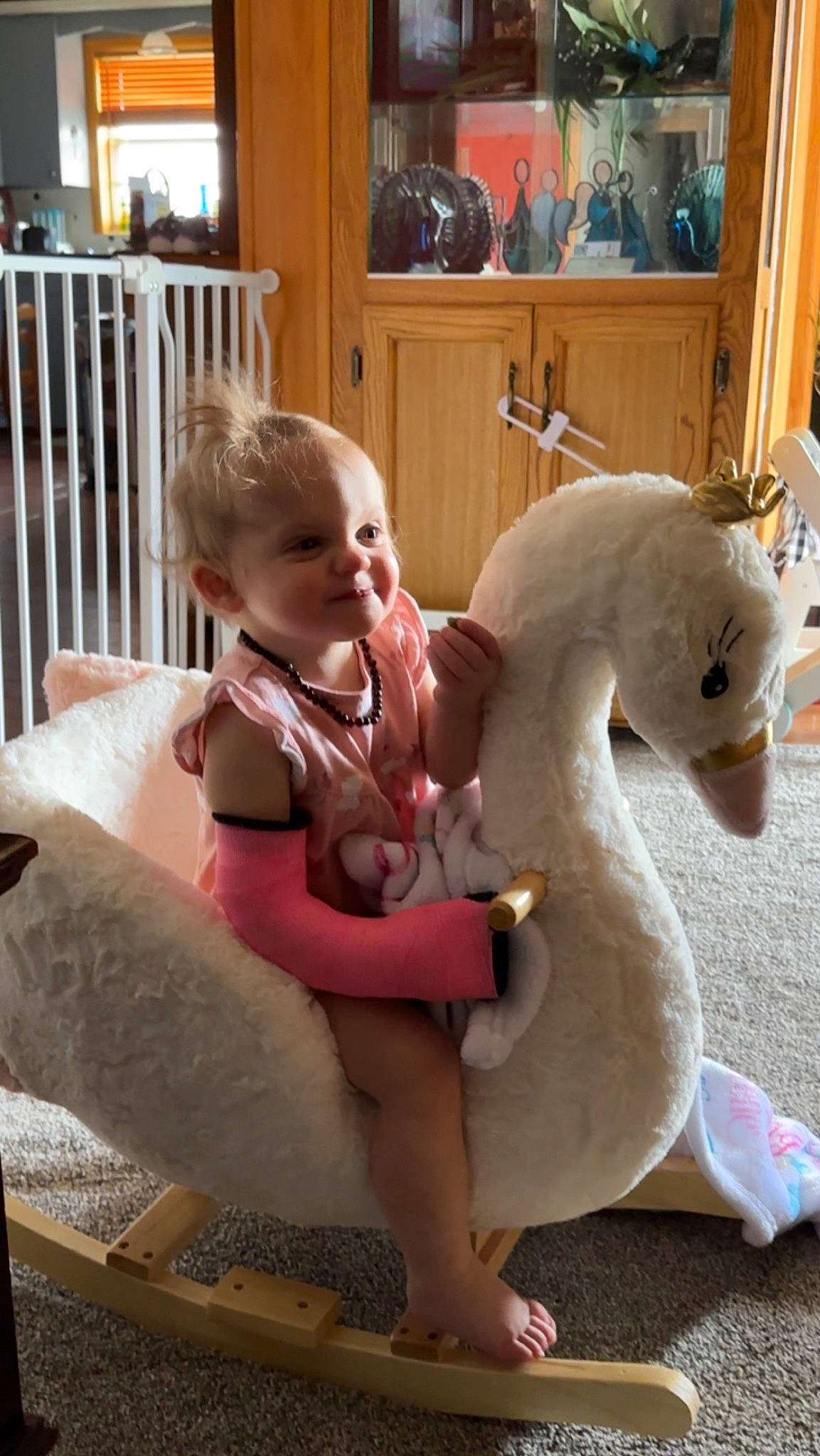 Adalynn is registered to the contest to win money with this photo: baby, baby_toddler_clothing, child, comfort, door, fence, foot, fun, happy, horse, leisure, person, picture_frame, play, room, sitting, smile, stuffed_toy, toddler, toy