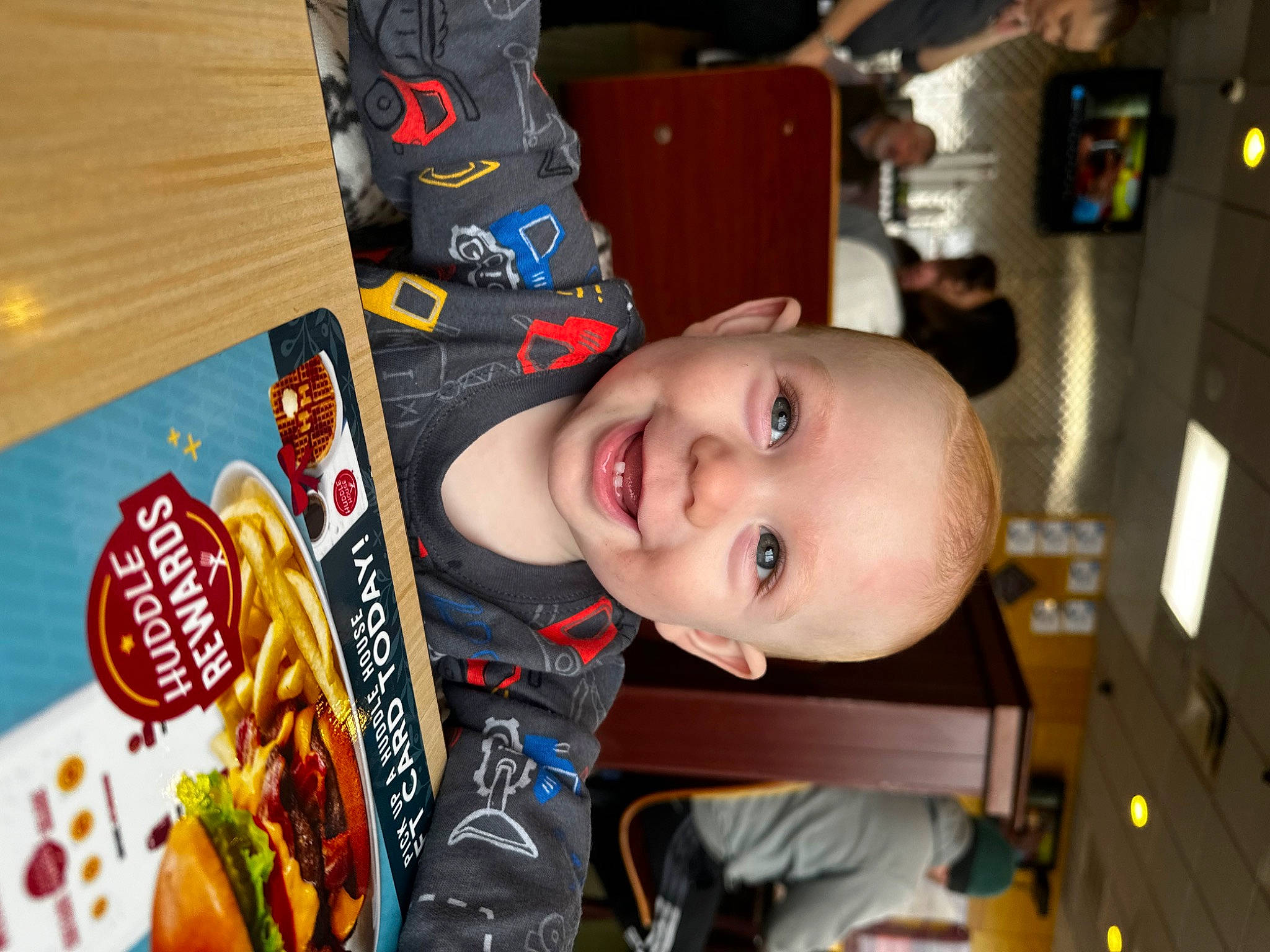 Dean is registered to the contest to win money with this photo: american_food, baby, baby_laughing, baby_toddler_clothing, blurred, chair, child, convenience_food, cuisine, finger_food, food, fun, happy, ingredient, joy, junk_food, laugh, natural_foods, person, room