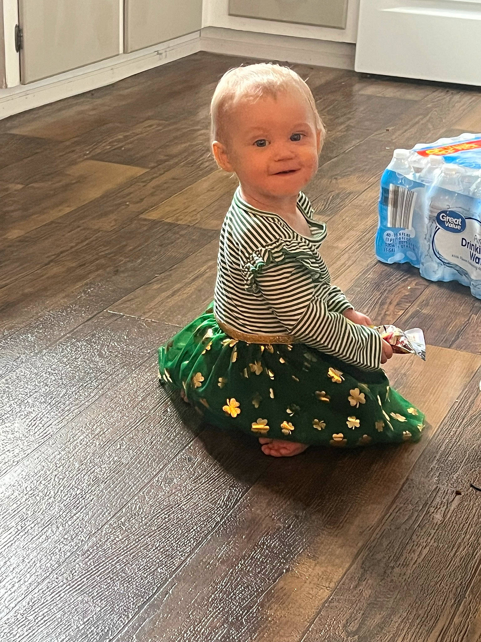 Serena joined the competition — help win amazing prizes! baby, baby_toddler_clothing, child, dress, floor, flooring, fun, hardwood, joy, kitchen_appliance, pattern, person, play, room, sitting, sleeve, smile, standing, toddler, wood