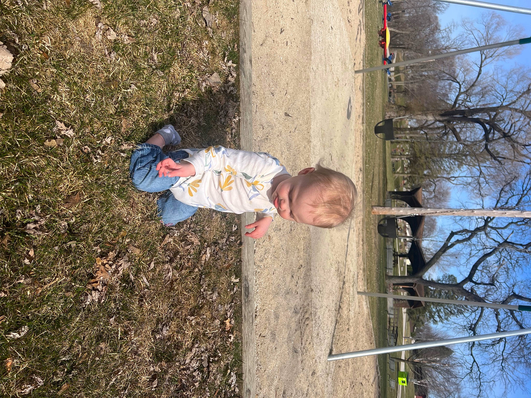Serena is registered to the contest to win money with this photo: baby_toddler_clothing, branch, child, fun, grass, leisure, people_in_nature, person, plant, reflection, sky, soil, spring, toddler, tree, trunk, twig, wood, woody_plant