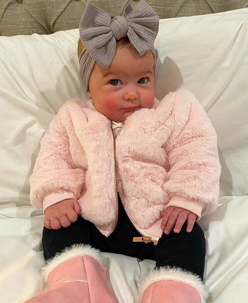 Collins joined the competition — help win amazing prizes! baby, baby_sleeping, baby_toddler_clothing, cap, cheek, child, comfort, facial_expression, fashion_accessory, foot, fur, gesture, headwear, linens, person, pink, skin, sleeve, smile, thumb