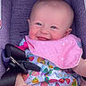 Tilly joined the competition — help win amazing prizes! baby, child, smiling, car_seat, britax, pink_bib, colorful_dress, butterfly_pattern, happy, infant, cute, portrait, sitting, seatbelt, clothing, face, cheerful, young_child, indoors, closeup