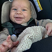 Christian joined the competition — help win amazing prizes! baby, child, car_seat, smiling, happy, blanket, seatbelt, infant, clothing, face, hand, indoor, cute, closeup, safe, person, toddler, comfort, young_child, car_interior