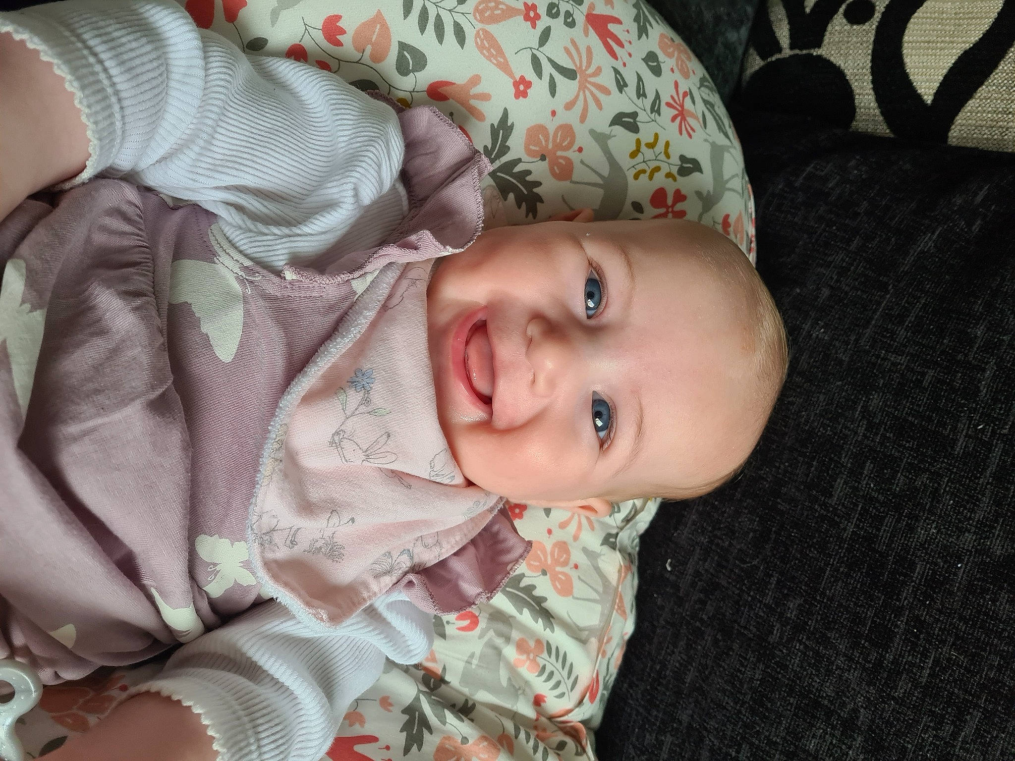 Holly is registered to the contest to win money with this photo: baby, baby_toddler_clothing, cheek, chin, comfort, eye, eyebrow, eyelash, face, head, iris, joy, lip, mouth, nose, person, skin, sleeve, smile, toddler