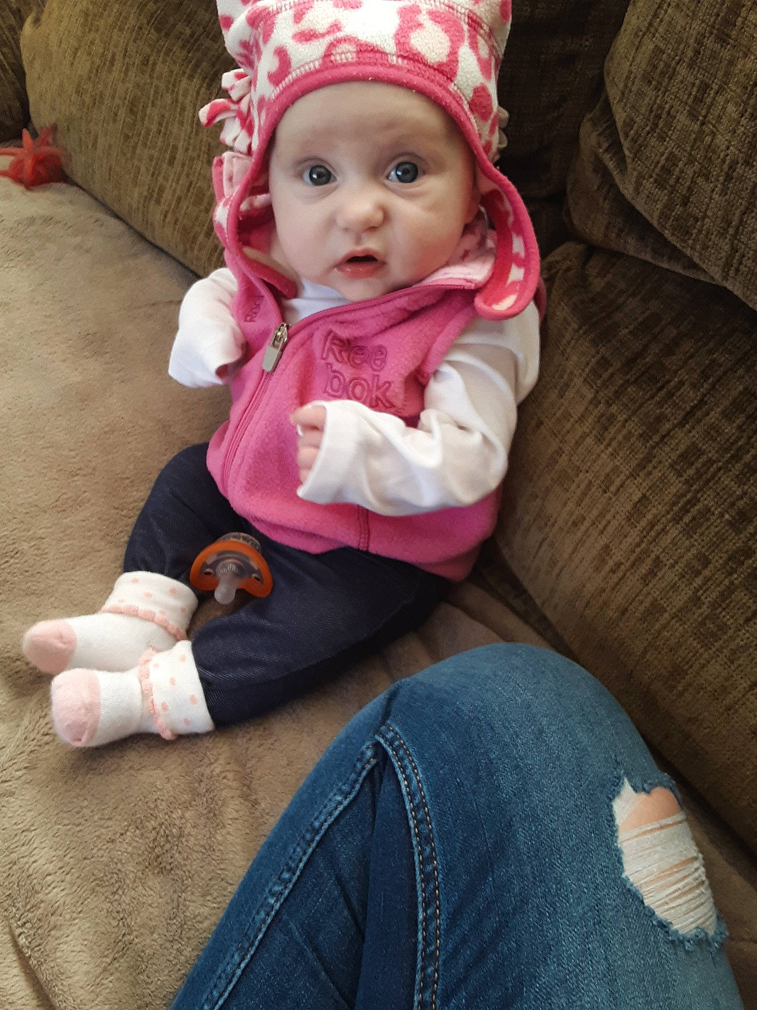 Carley is registered to the contest to win money with this photo: baby, cheek, child, headgear, headwear, person, pink, product, sitting, skin, toddler