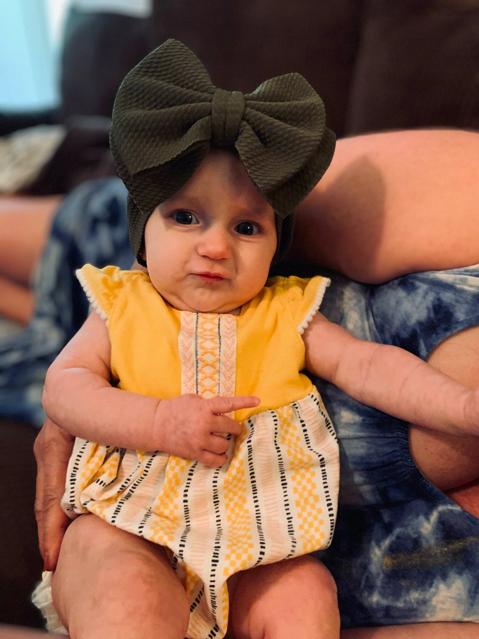 Reidlyn joined the competition — help win amazing prizes! baby, baby_toddler_clothing, cap, cheek, child, comfort, eye, face, facial_expression, finger, fun, happy, head, headwear, human_leg, lap, leisure, person, skin, thigh