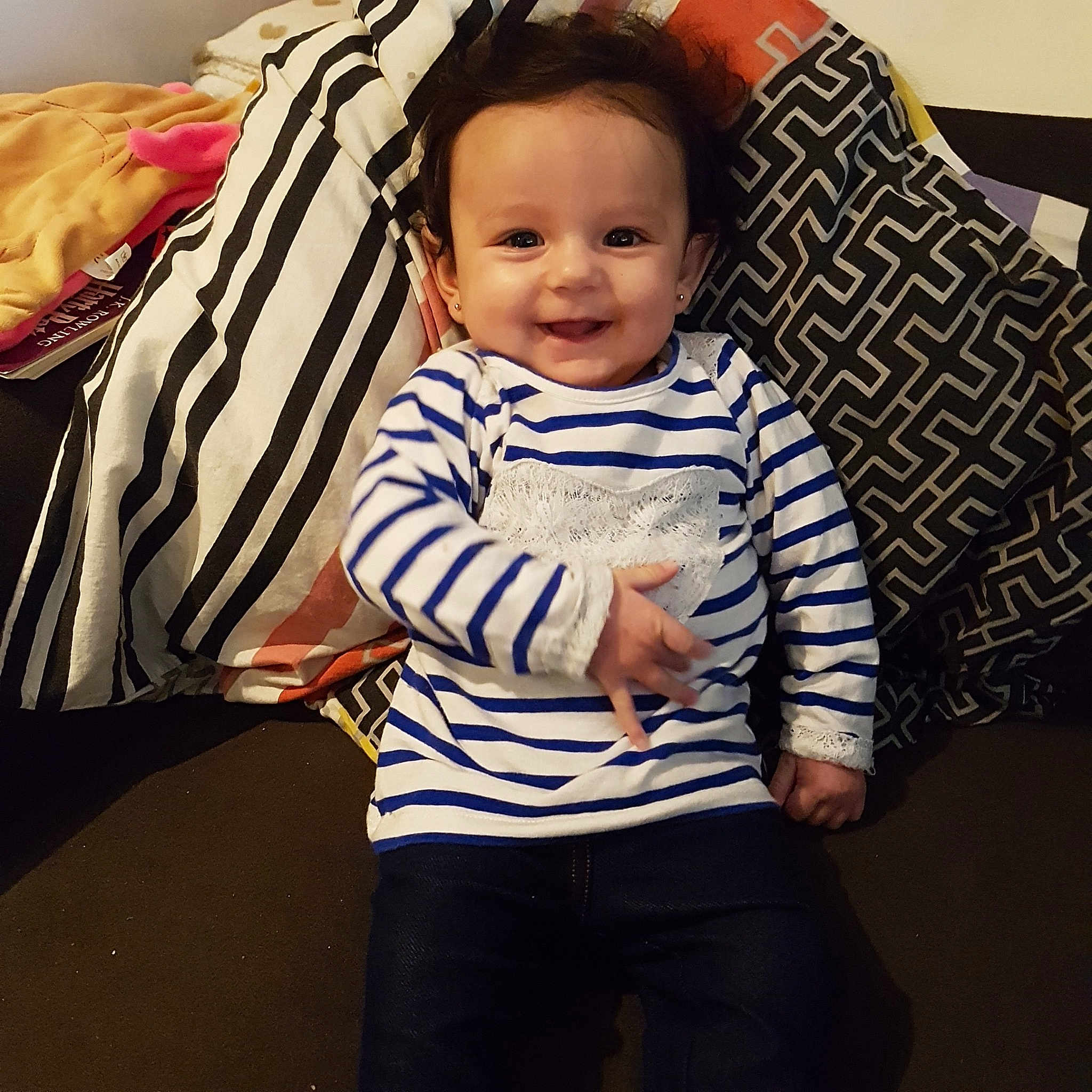 Melynna participe au concours pour gagner de l'argent avec cette photo : baby, cheek, child, cool, eye, face, furniture, head, joy, outerwear, person, play, room, sitting, skin, sleeve, t_shirt, toddler