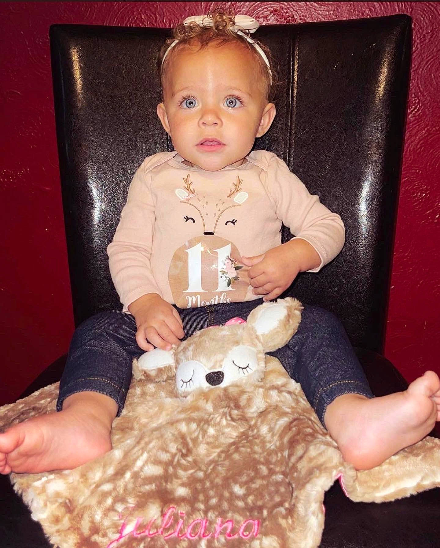Juliana is registered to the contest to win money with this photo: baby, baby_products, baby_toddler_clothing, chair, child, dessert, finger, fun, fur, happy, pattern, peach, person, pink, ruffle, sitting, skin, sleeve, toddler, toy