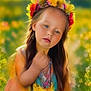 blurred_background, child, colorful, dress, expression, face, fantasy, field, flower_crown, flowers, greenery, hand, long_hair, nature, outdoor, portrait, skin, soft_focus, summer, young_girl