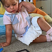 Bonnie-Leigh is registered to the contest to win money with this photo: carpet, child, curly_hair, cute, decor, food, furniture, indoor, living_room, photo_frame, pigtails, pink_socks, plate, playing, plush_toy, short_sleeve_shirt, stuffed_animal, tablet, toddler, white_skirt