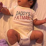 Santi joined the competition — help win amazing prizes! arm, baby, bed, blanket, clothing, cute, face, hair, humor, indoors, infant, leg, lying_down, onesie, person, skin, sleepwear, socks, soft, text