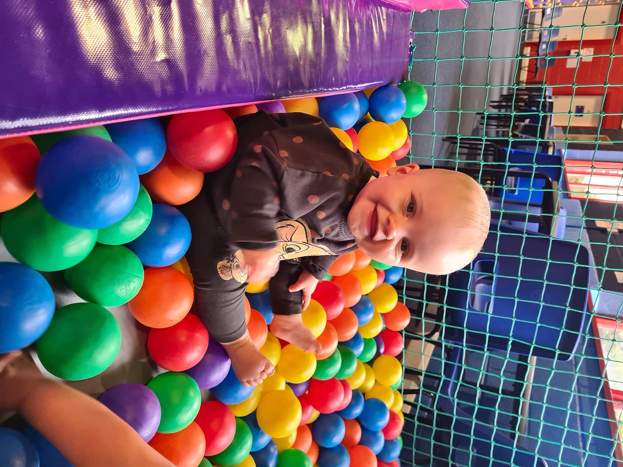 Charley is registered to the contest to win money with this photo: baby, baby_toys, ball_pit, child, event, fun, happy, human_settlement, joy, leisure, party, party_supply, person, play, play_yard, playground, recreation, room, smile, toddler
