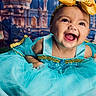 baby, child, toddler, portrait, smiling, happy, laughing, face, eyes, open_mouth, dress, costume, turquoise, gold, bow, crown, sequins, indoor, palace, royal