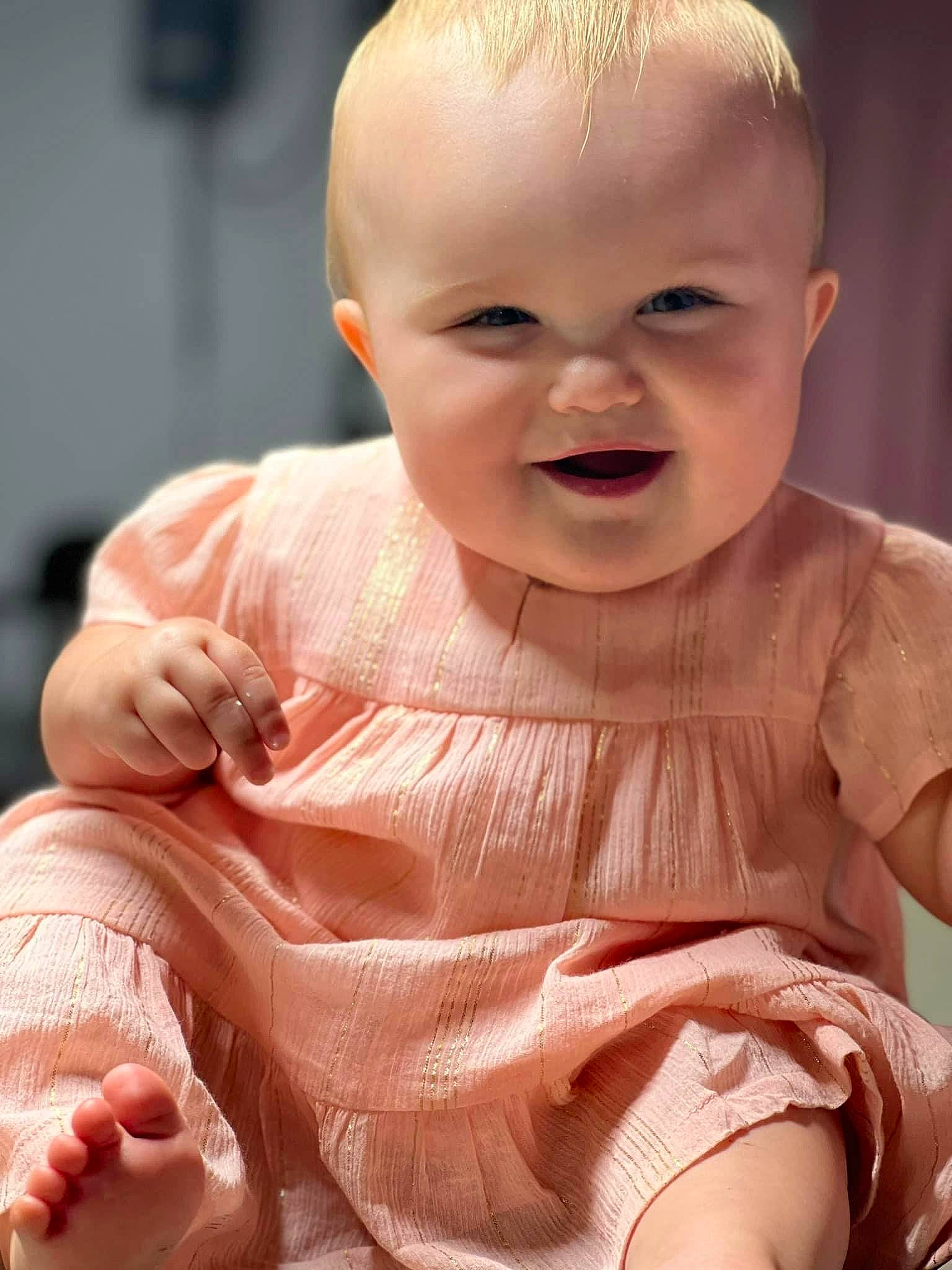 Raelynn is registered to the contest to win money with this photo: baby, baby_toddler_clothing, cheek, chin, dress, eye, face, facial_expression, head, joint, joy, leg, lip, mouth, muscle, nose, person, product, skin, sleeve