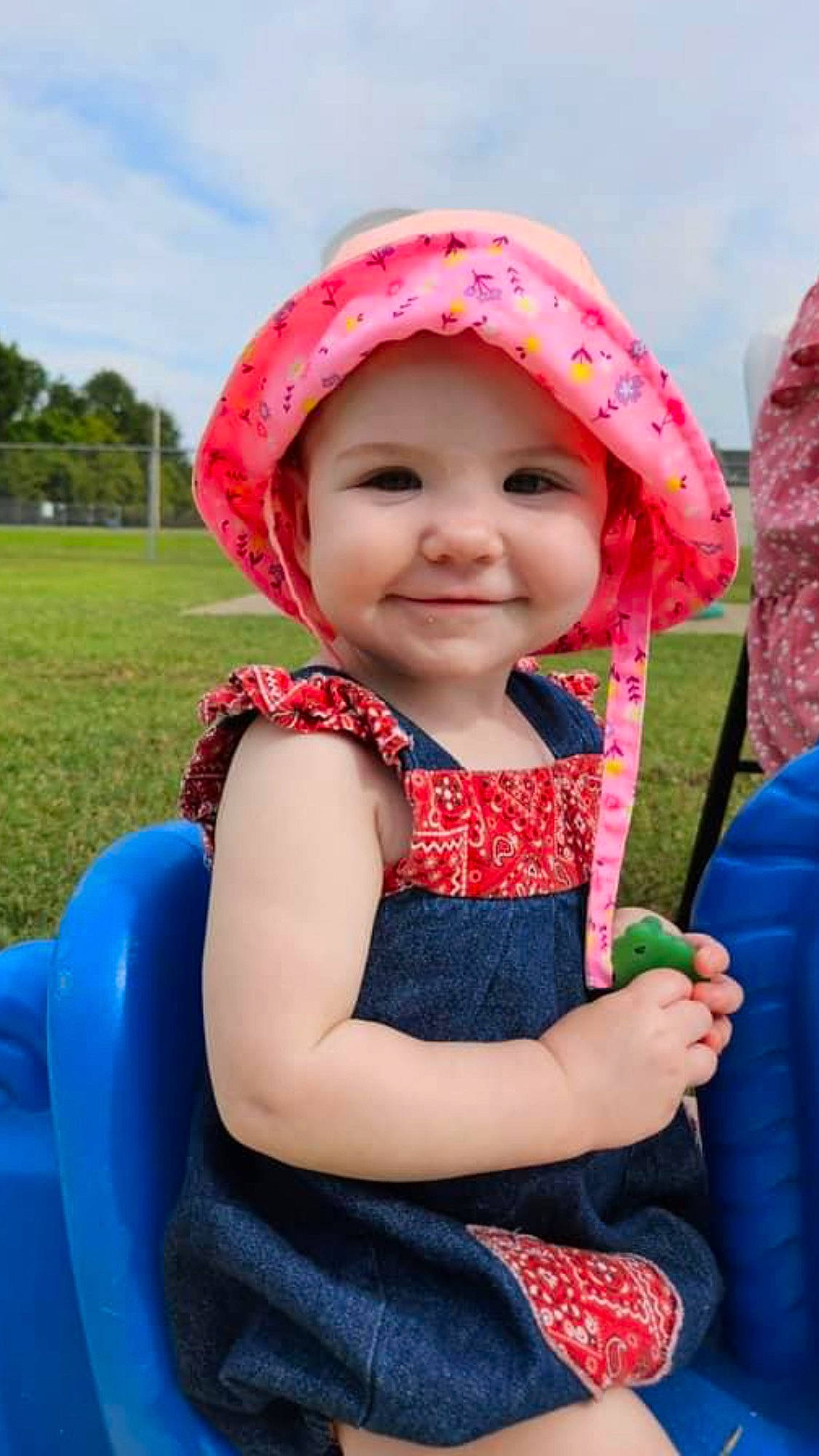Rori joined the competition — help win amazing prizes! blue, cap, eye, face, facial_expression, fun, grass, happy, headgear, headwear, human_body, joy, leisure, people_in_nature, person, pink, public_space, red, skin, sky