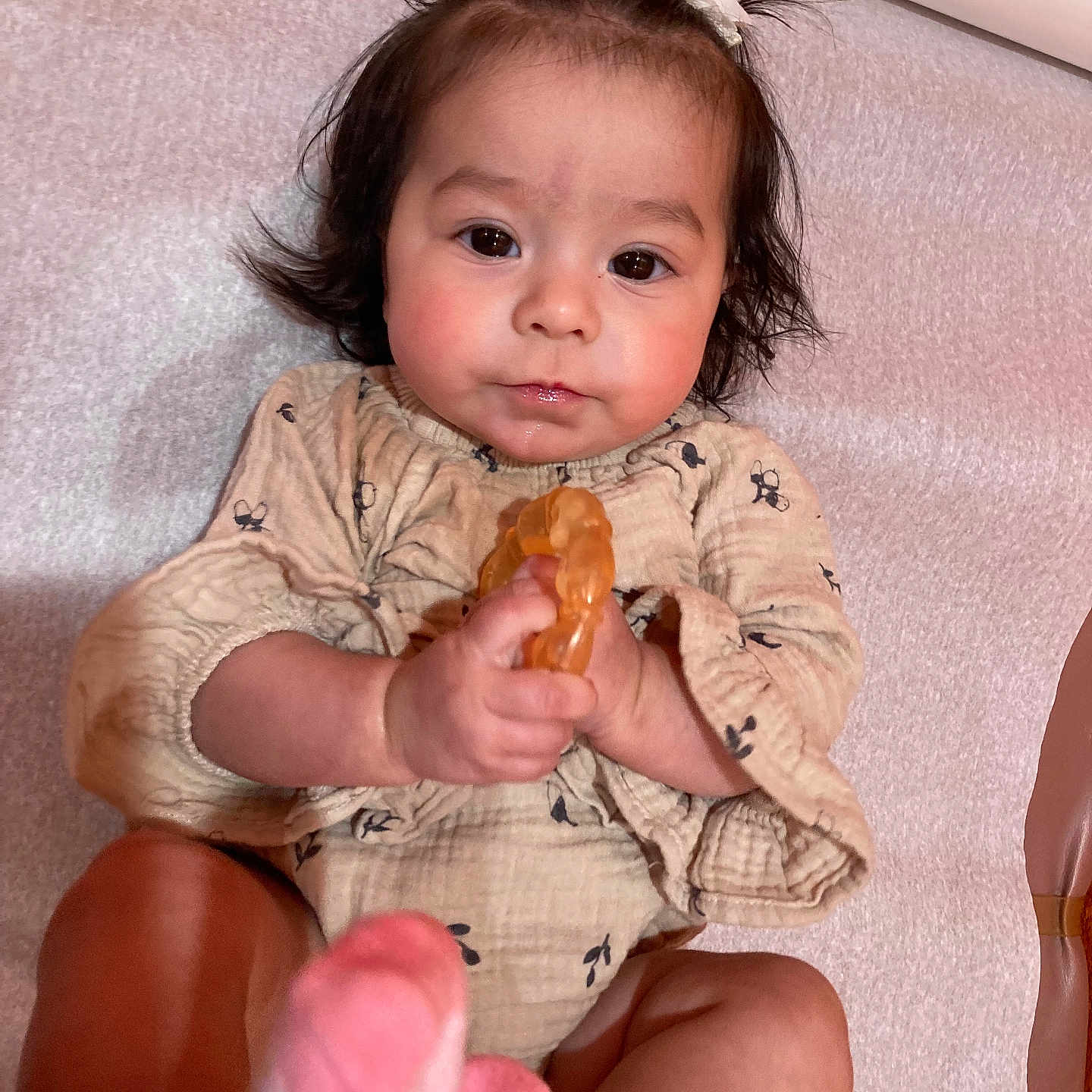 Heavenly is registered to the contest to win money with this photo: baby, bodypart, clothing, couch, cream, cutlery, dress, eating, face, finger, food, furniture, hand, head, person, photography, portrait, sitting, spoon, sweets