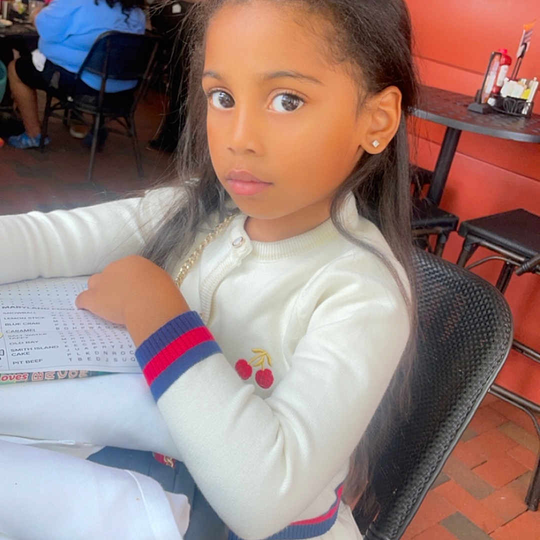 Sevyn joined the competition — help win amazing prizes! adult, architecture, building, cafe, cafeteria, child, diningtable, face, female, furniture, girl, head, indoors, person, photography, portrait, restaurant, sitting, table, woman