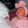 Ava is registered to the contest to win money with this photo: baby, newborn, sleeping, pink, headband, bow, onesie, infant, child, cozy, soft, blanket, hand, face, peaceful, indoors, person, cute, rest, sleep