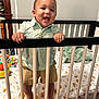 Elisha Garcia Rivera joined the competition — help win amazing prizes! toddler, crib, child, smiling, indoor, baby, bed, blanket, nursery, wall_art, toy, clothing, happy, person, hand, foot, railing, fabric, furniture, room