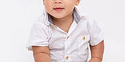 Elisha Garcia Rivera is registered to the contest to win money with this photo: baby, toddler, child, barefoot, white_shirt, blue_jeans, sitting, curious, cute, portrait, studio, isolated, hands, feet, smiling, innocent, young, fashion, casual, front_view