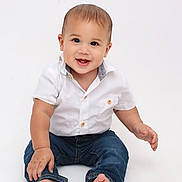 Elisha Garcia Rivera joined the competition — help win amazing prizes! baby, barefoot, blue_jeans, bright_background, casual_clothing, child, cute, expression, front_view, happy, infant, innocence, isolated, one_person, portrait, sitting, smiling, studio, white_shirt, young_child