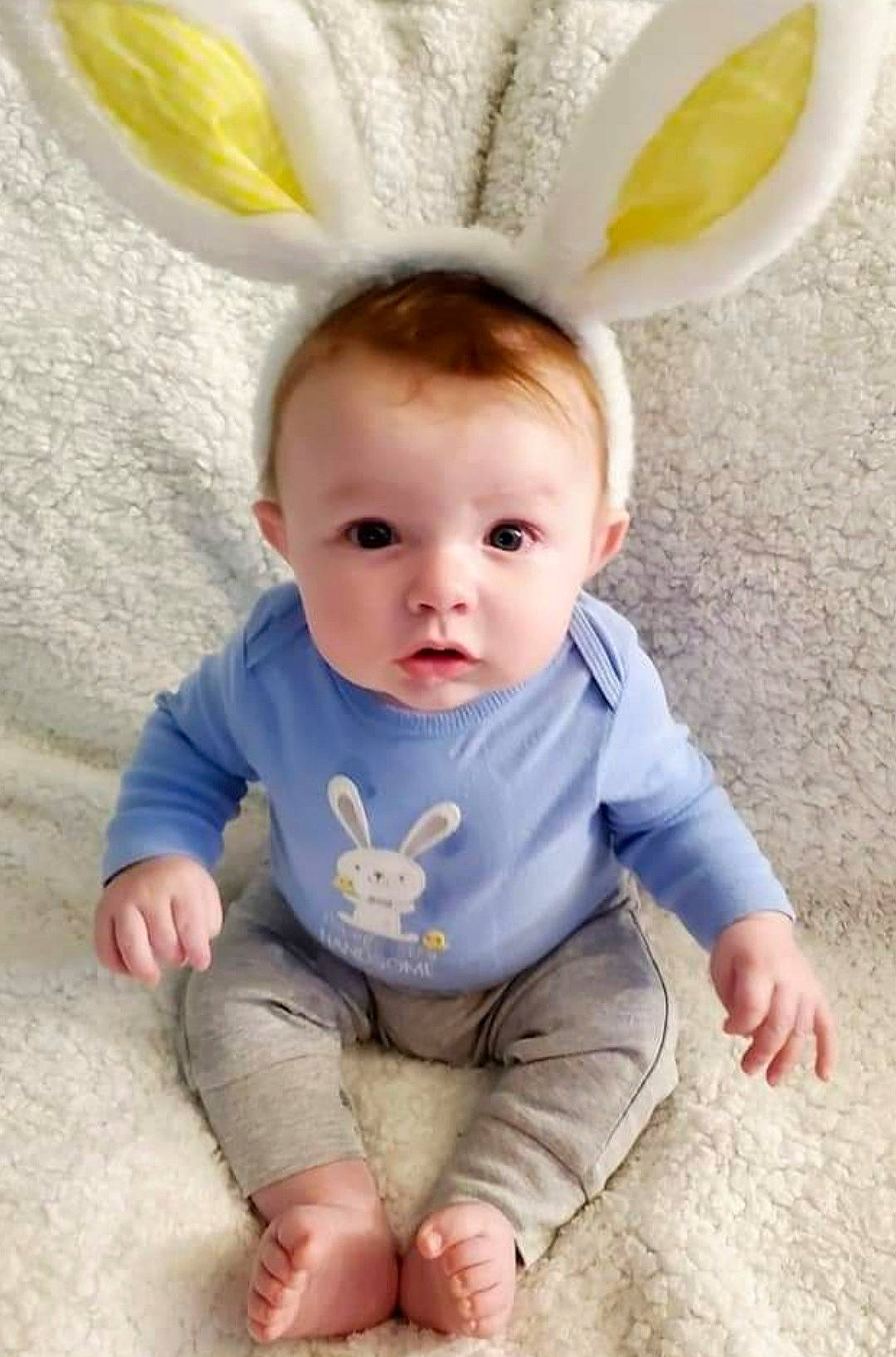 Axton is registered to the contest to win money with this photo: baby, baby_toddler_clothing, clothing, ear, eye, finger, happy, head, human_body, iris, organ, people, person, pink, skin, sleeve, smile, textile, toddler, white