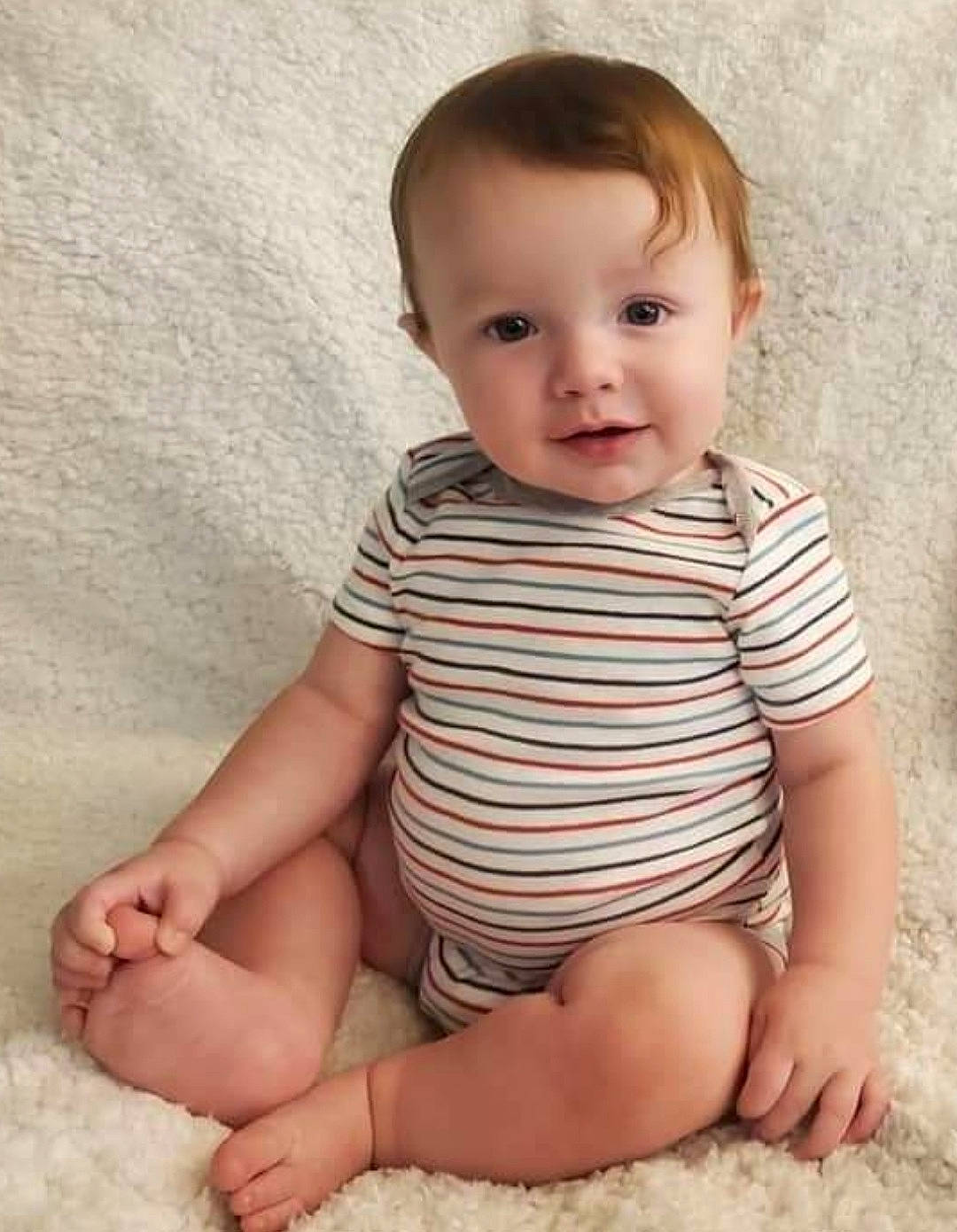 Axton joined the competition — help win amazing prizes! arm, baby, baby_toddler_clothing, cheek, chin, clothing, collar, comfort, face, finger, head, human_leg, iris, leg, neck, pattern, person, skin, sleeve, standing