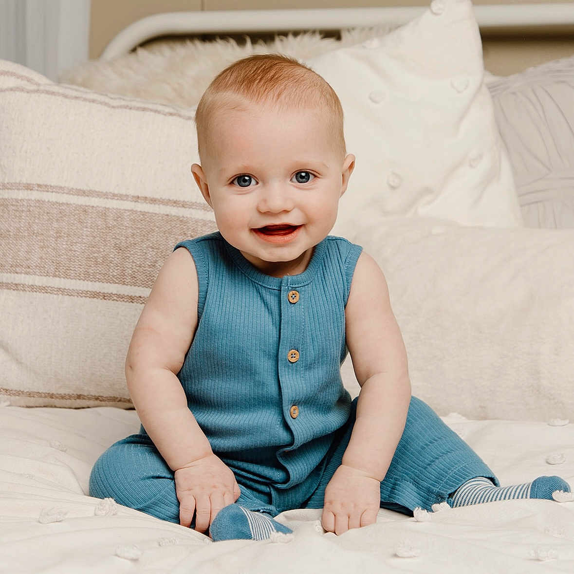 Knox is registered to the contest to win money with this photo: baby, bed, clothing, couch, crawling, cushion, face, furniture, happy, head, homedecor, hosiery, jeans, pants, person, photography, portrait, sitting, smile, sock