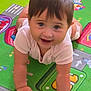 Cataleya joined the competition — help win amazing prizes! baby, child, crawling, play_mat, colorful, smiling, happy, infant, cute, short_hair, onesie, indoors, floor, toy_pattern, young_child, cute_expression, hand, face, person, skin