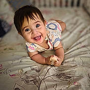 Cataleya joined the competition — help win amazing prizes! baby, smile, happy, infant, bed, blanket, pattern, flower, cute, child, face, person, clothing, toy, lying, home, young, bright_eyes, cheerful, indoor